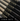 Close-up of MÄRK Lumber stock baseball bats with black finish and maple handles, showcasing the bold MÄRK logo for immediate purchase and use.