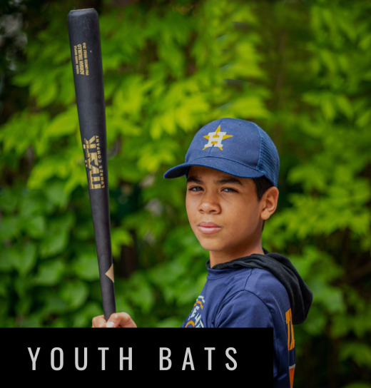Young baseball player holding a MÄRK Lumber youth bat, designed for juniors, showcasing durability and performance in a game-ready model.