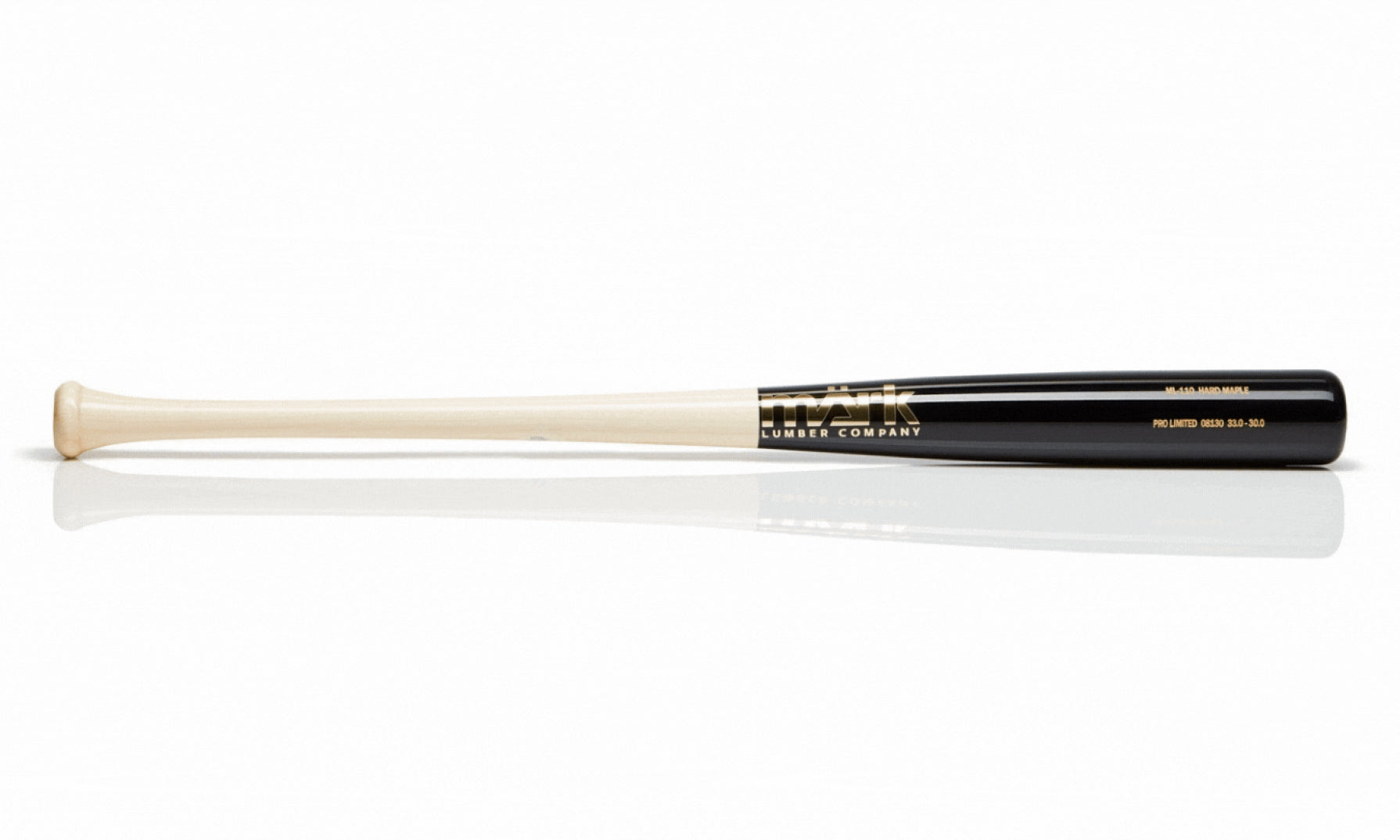 A black and natural wood baseball bat with the "märk LUMBER COMPANY" logo in gold, engraved with "Pro Limited" and size details on the side.